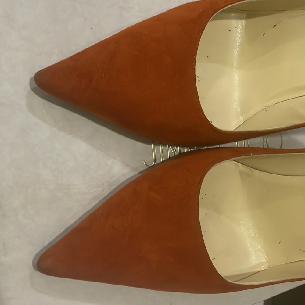 Jimmy Choo burnt orange pumps.